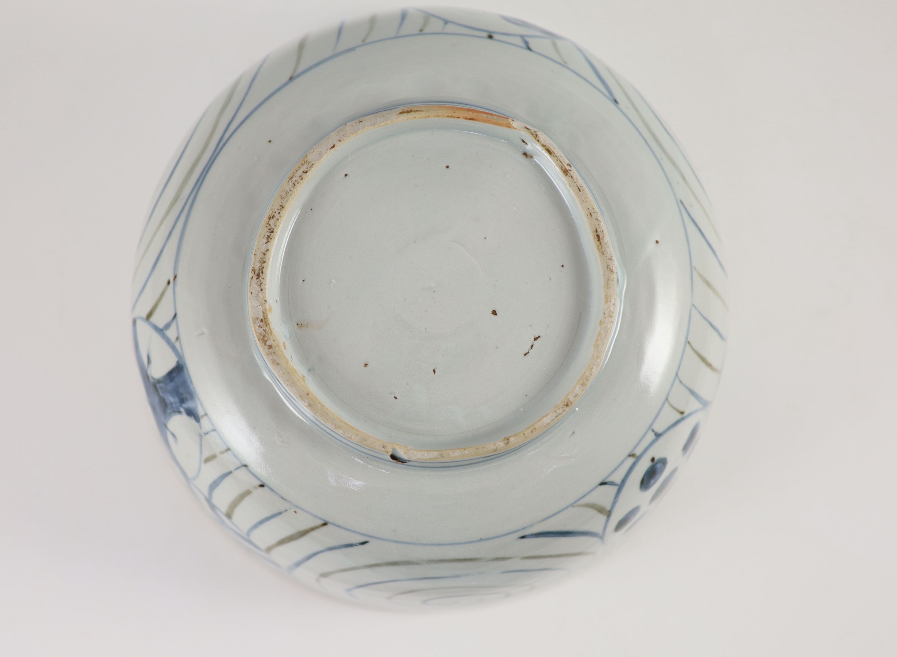 An unusual underglaze blue and iron brown bowl, probably Korean, Joseon dynasty, 18th/19th century, 23cm diameter, lacking its cover, cracked